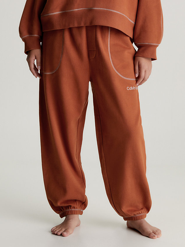 orange spodnie dresowe po domu - future shift dla kobiety - calvin klein