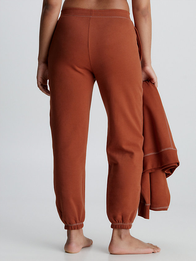 orange spodnie dresowe po domu - future shift dla kobiety - calvin klein