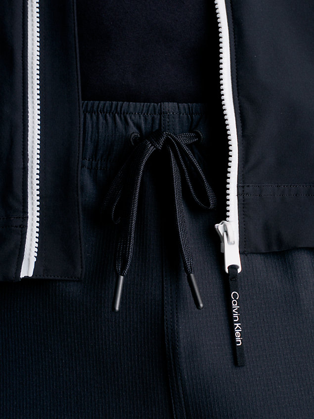 black spodnie dresowe z 4-kierunkowego streczu dla mężczyźni - ck performance