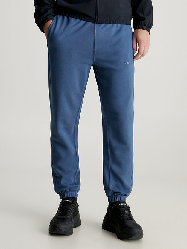 crayon blue swobodne spodnie dresowe z bawełny frotte dla mężczyźni - ck performance