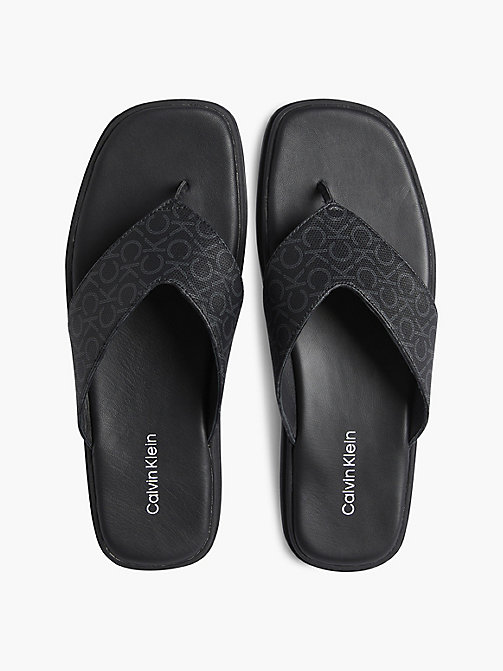 Homme Chaussures Sandales claquettes et tongs Sandales en cuir Claquettes à monogramme Jean Calvin Klein pour homme en coloris Noir 