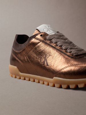 bronze/rocky brown/gum high-shine low-profile runner trainers for women calvin klein