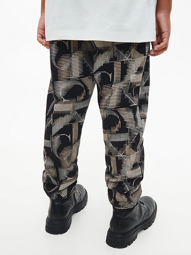 multi monogram aop black logo printed trousers for boys calvin klein jeans