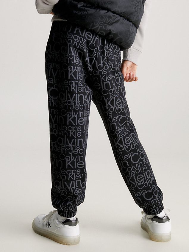 black relaxed glow-in-the-dark logo joggers for boys calvin klein jeans