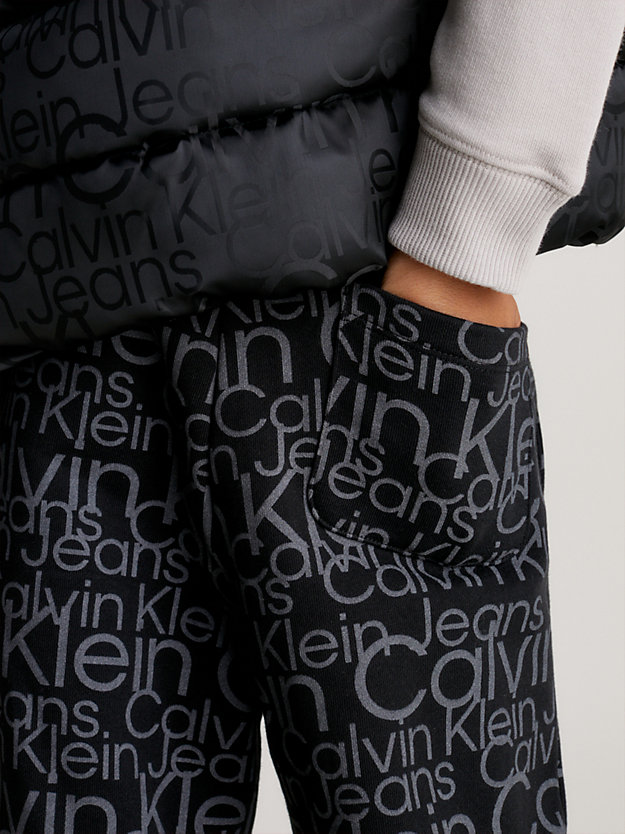 debossed black aop relaxed glow-in-the-dark logo joggers for boys calvin klein jeans