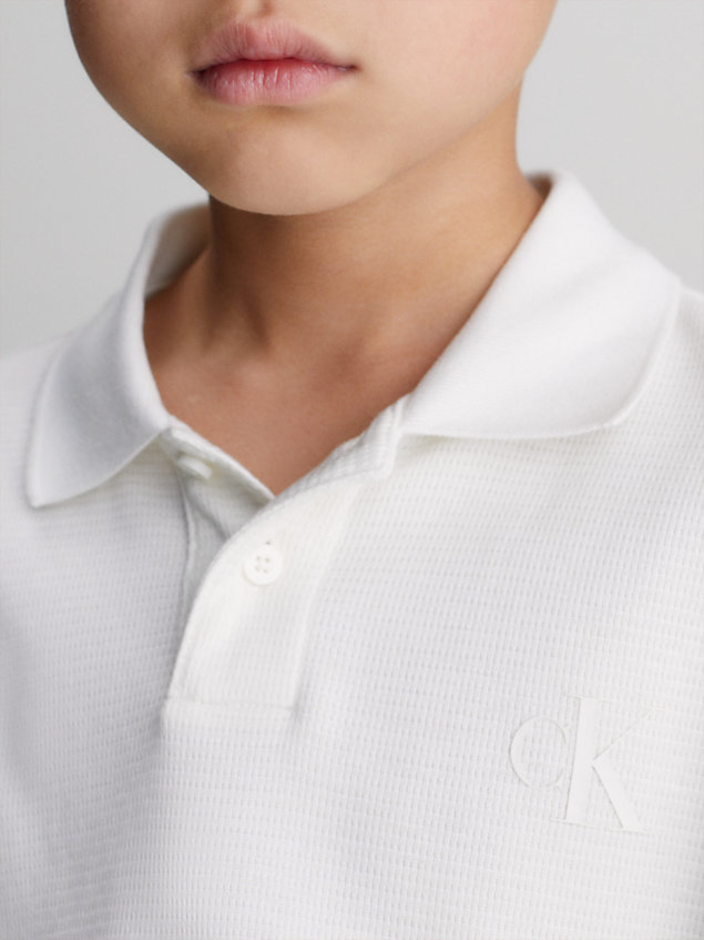 white relaxed long sleeve polo shirt for boys calvin klein jeans