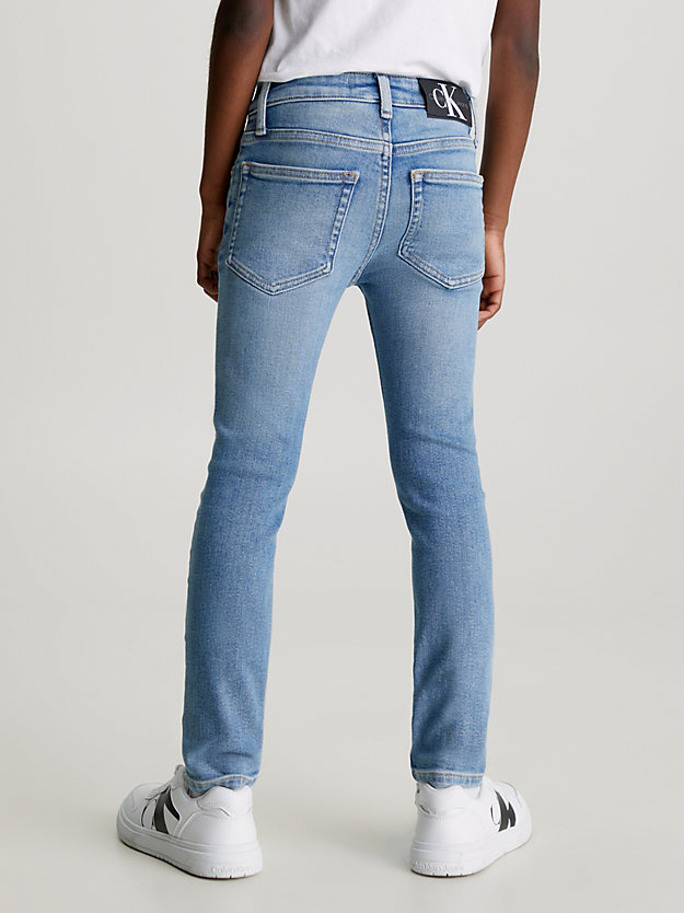 cloudy blue stretch mid rise skinny jeans for boys calvin klein jeans