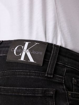 washed black cf mid rise slim jeans for boys calvin klein jeans