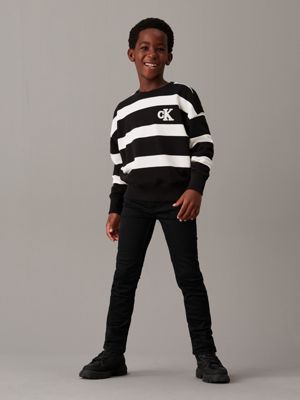 jean slim mid rise essential black stretch pour garçons calvin klein jeans