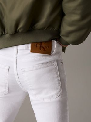 white mid rise flared jeans for girls calvin klein jeans