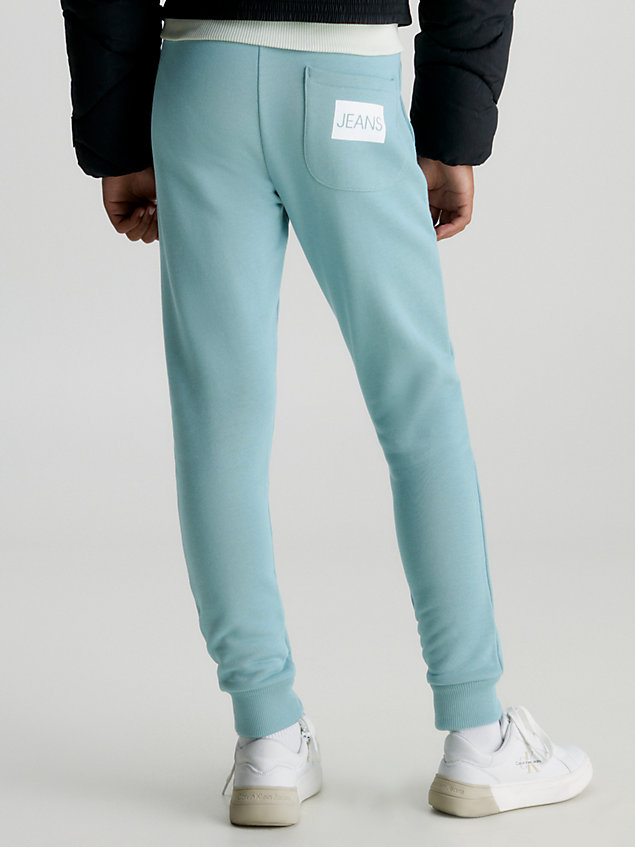 blue spodnie dresowe unisex, fason slim dla kids unisex - calvin klein jeans