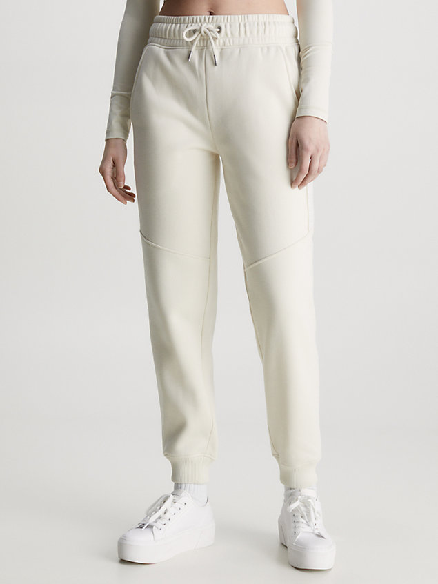 beige relaxed joggingbroek met logo tape voor dames - calvin klein jeans