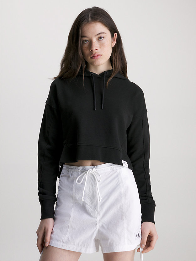 ck black swobodna bluza z kapturem o skróconym kroju dla kobiety - calvin klein jeans
