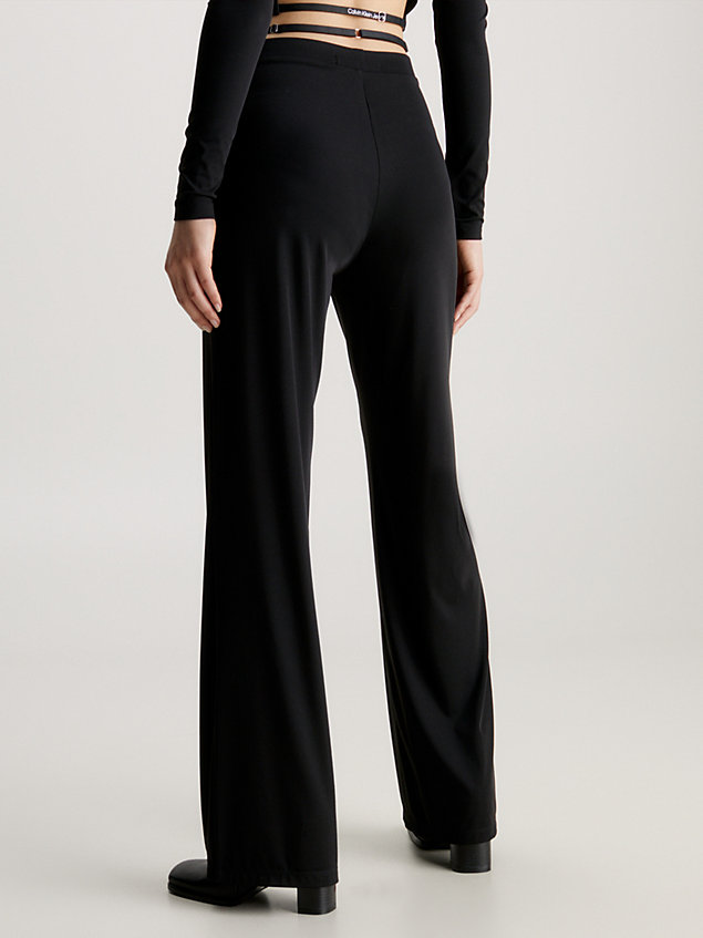 black strap detail flared jersey trousers for women calvin klein jeans