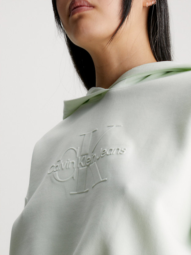 sweat-shirt à capuche court avec logo gaufré canary green pour femmes calvin klein jeans