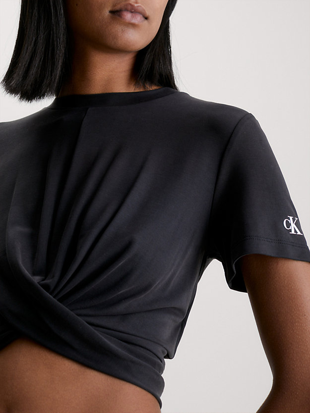 CK BLACK Cropped gedraaid T-shirt voor dames CALVIN KLEIN JEANS