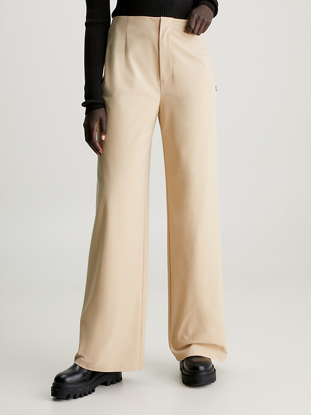 pantalones de punto de pernera ancha beige de mujeres calvin klein jeans