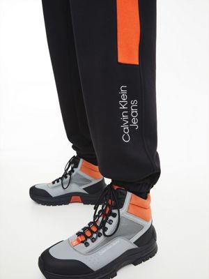 CK BLACK / CORAL ORANGE Lässige Jogginghose in Blockfarbendesign für men CALVIN KLEIN JEANS