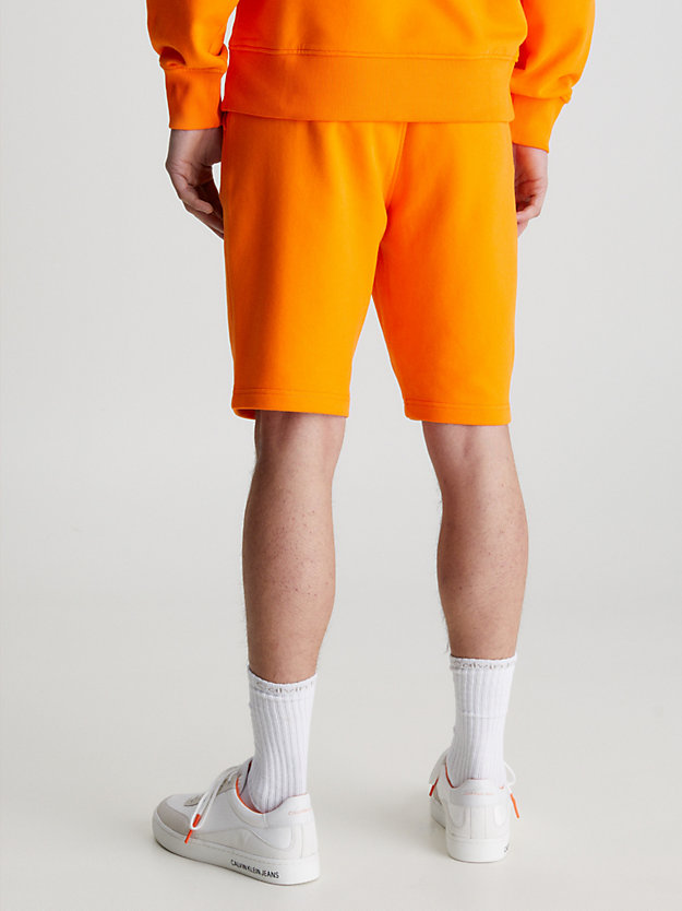 VIBRANT ORANGE Monogram Jogger Shorts for men CALVIN KLEIN JEANS