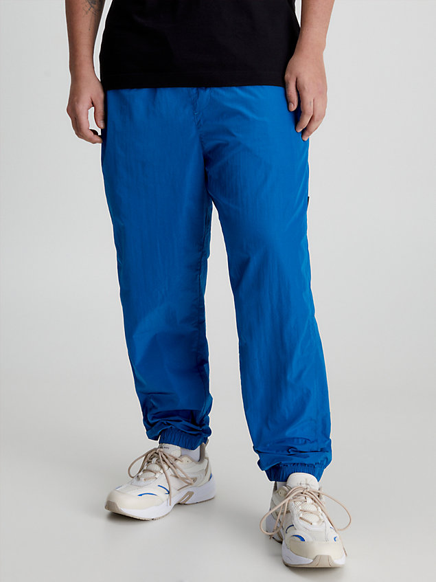 blue recycled nylon tapered trousers for men calvin klein jeans