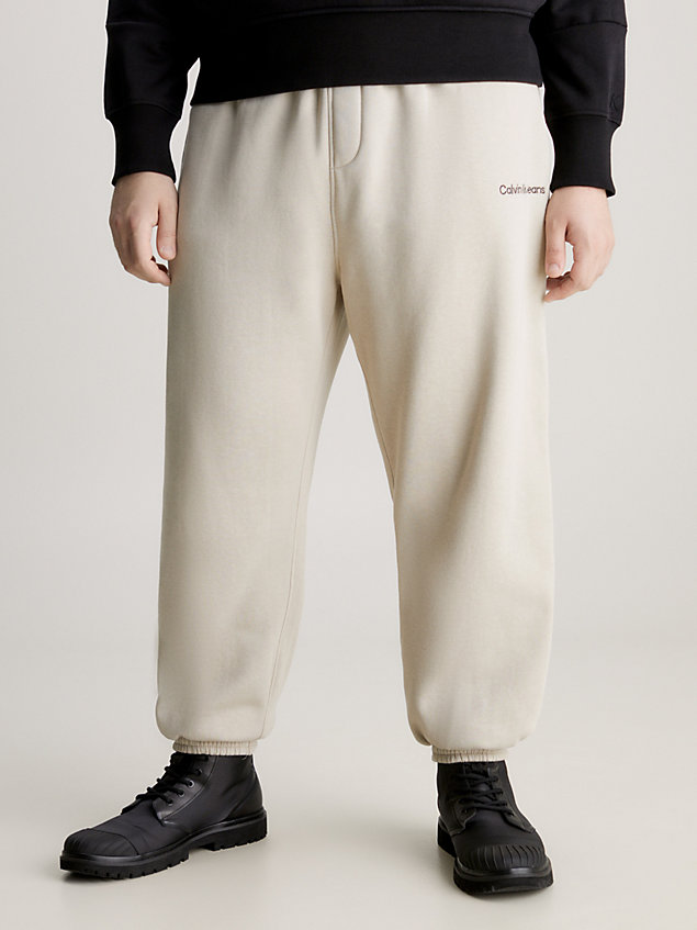 beige swobodne spodnie dresowe z bawełny dla mężczyźni - calvin klein jeans