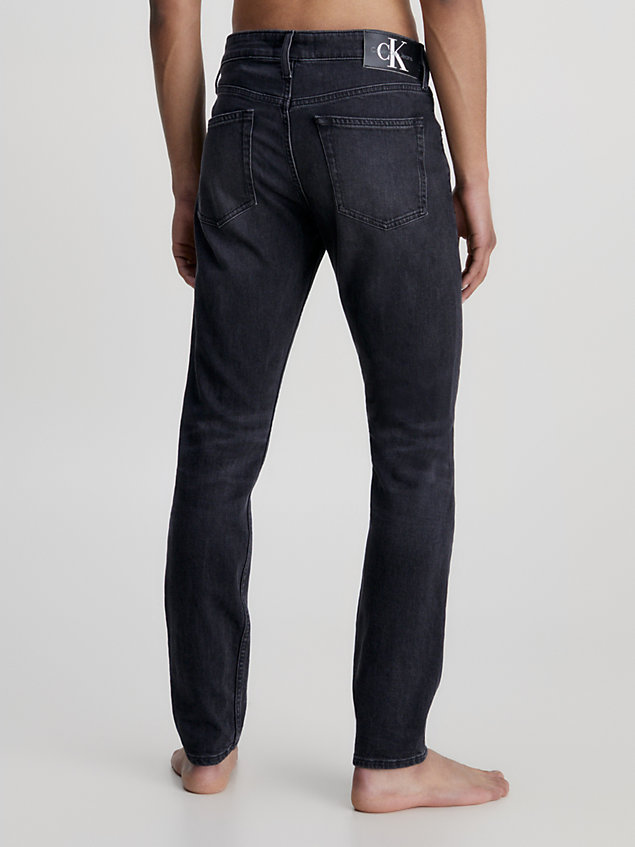 black slim fit tapered jeans for men calvin klein jeans