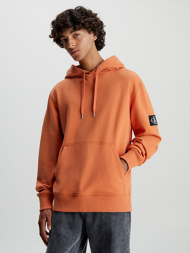 orange cotton terry badge hoodie for men calvin klein jeans