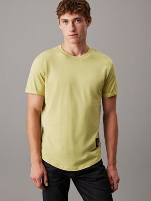 desaturated yellow cotton badge t-shirt for men calvin klein jeans