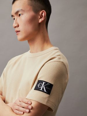 pale khaki waffle cotton badge t-shirt for men calvin klein jeans