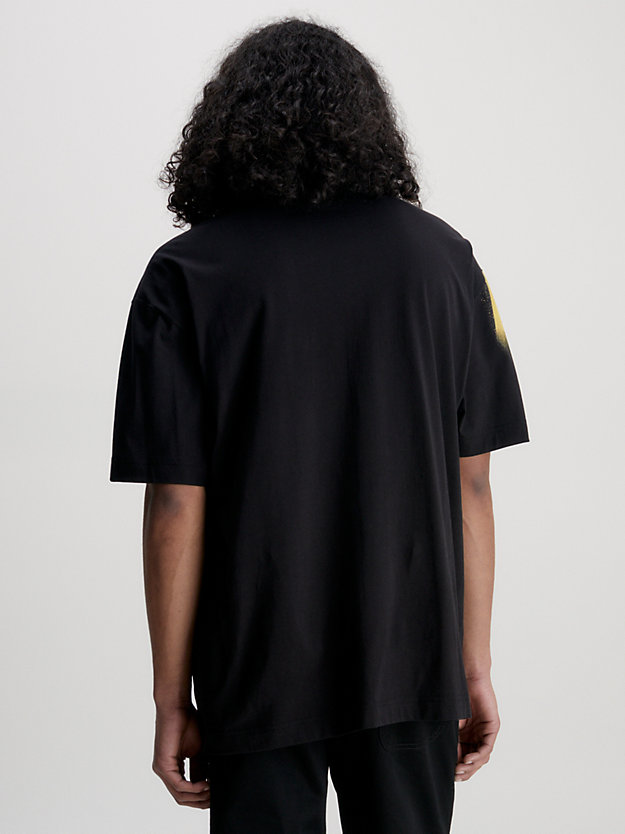 CK BLACK Camiseta oversize con estampado de spray de hombre CALVIN KLEIN JEANS