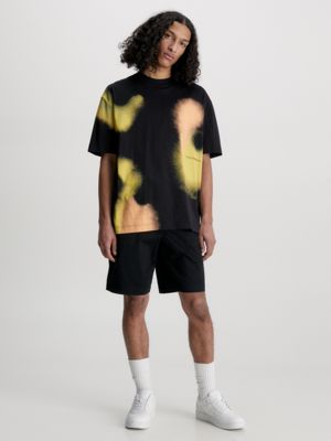 ck black oversized spray print t-shirt for men calvin klein jeans