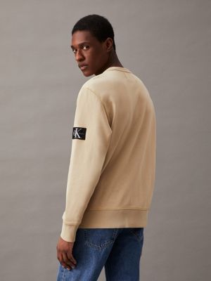 pale khaki washed cotton badge sweatshirt for men calvin klein jeans