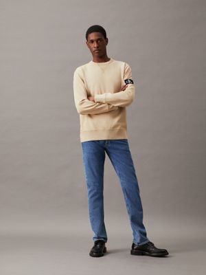 pale khaki washed cotton badge sweatshirt for men calvin klein jeans