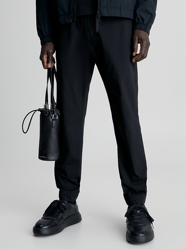 black cropped tapered trousers for men calvin klein