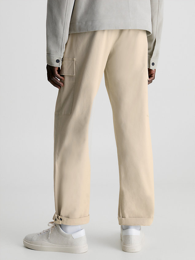 beige relaxed cargo trousers for men calvin klein