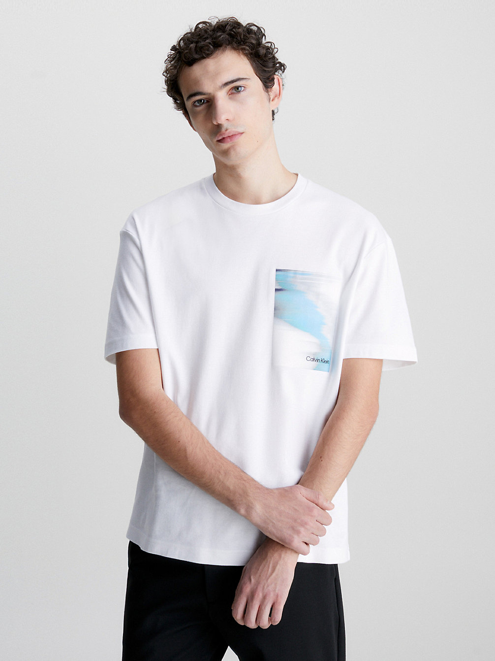 T-Shirt In Cotone Biologico Con Stampa Glitch > BRIGHT WHITE > undefined uomo > Calvin Klein