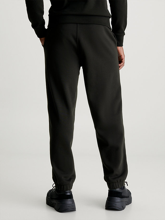 black swobodne spodnie dresowe z bawełnianego polaru dla mężczyźni - calvin klein