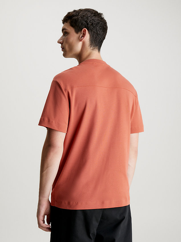 t-shirt avec logo gravé en creux orange pour hommes calvin klein