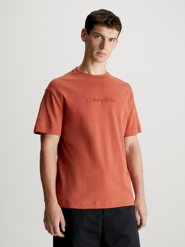 t-shirt avec logo gravé en creux orange pour hommes calvin klein