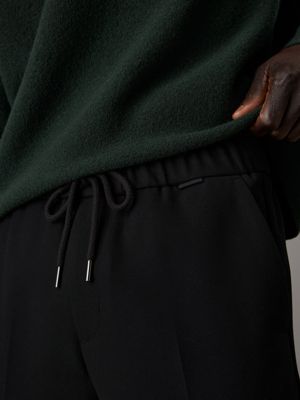 pantaloni affusolati in maglia con pieghe ck black da uomini calvin klein