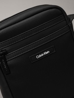 black rubberized small reporter bag for men calvin klein