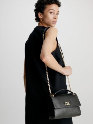 Women's Calvin Klein white and tan shoulder bag  Tan shoulder bag, Calvin  klein bag, Beige purses