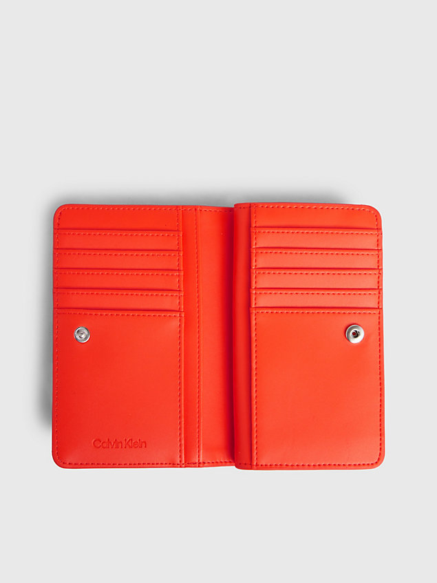 orange quilted rfid bifold wallet for women calvin klein