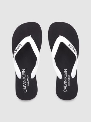 white and black flip flops