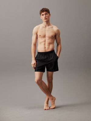 Medium Badeshorts mit Tunnelzug - Logo Tape Calvin Klein® | KM0KM00741BEH