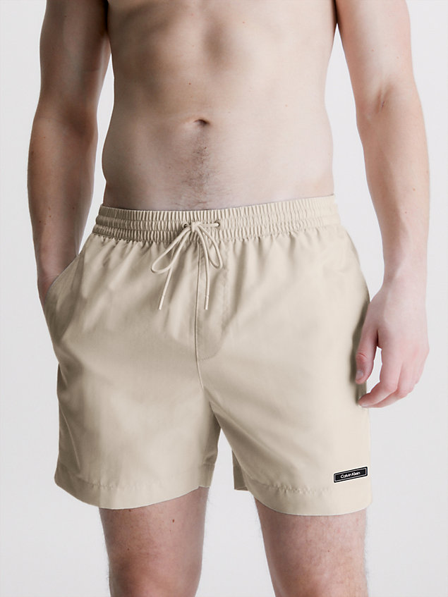beige medium drawstring swim shorts - core solids for men calvin klein