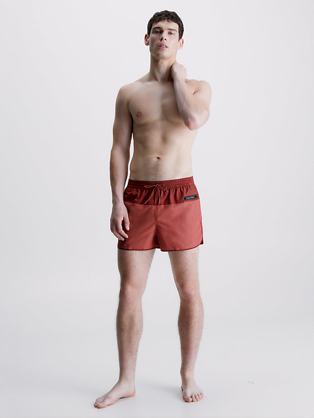 red short runner swim shorts - core solids for men calvin klein