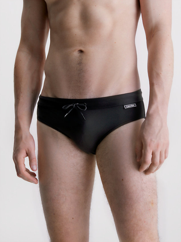 black swim briefs - core solids for men calvin klein