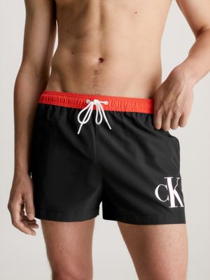 Kurze Badeshorts mit Kordelzug - CK Monogram Calvin Klein® | KM0KM00901BEH