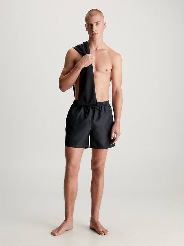 black swim shorts and towel gift pack for men calvin klein